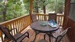 Spacious sitting area on covered deck.